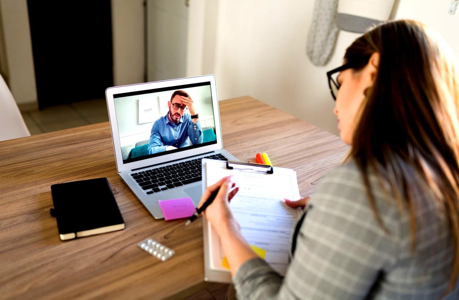 Tourism industry professionals collaborating in a modern workspace with global travel destinations visible